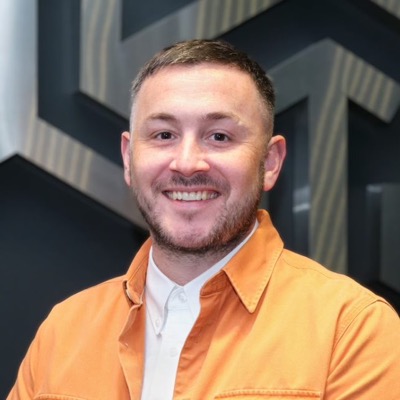 Headshot of Alex Coates, Managing Director